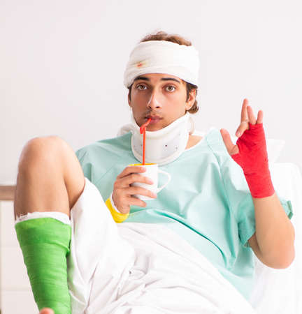 Young injured man staying in the hospitalの写真素材