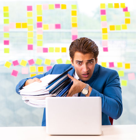 Busy businessman working in the officeの写真素材
