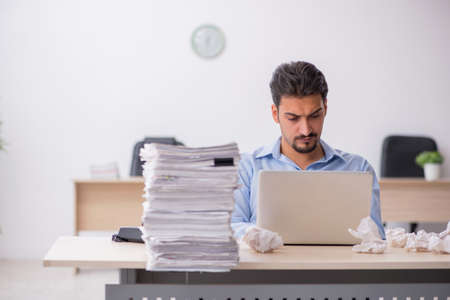 Young male employee rejecting new ideas in the officeの写真素材