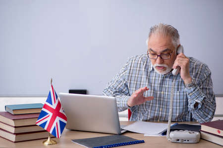 Old english language teacher in the classroomの写真素材