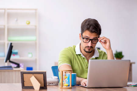 Young male designer working in the officeの写真素材