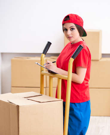 Young female professional mover doing home relocationの写真素材