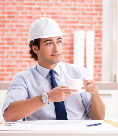 The construction supervisor working on blueprintsの写真素材
