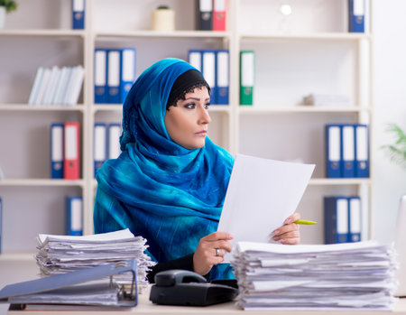 Female employee in hijab working in the officeの写真素材