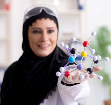 Female chemist in hijab working in the labの写真素材