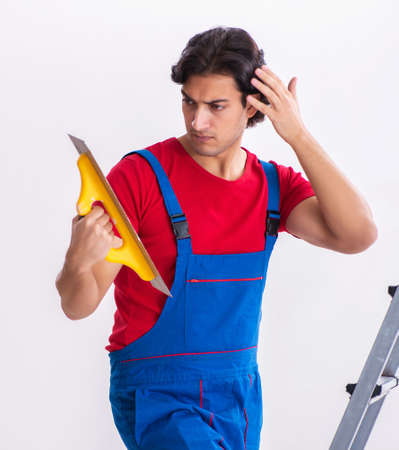 Young handsome contractor working indoorsの写真素材