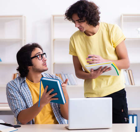 Two male students in the classroomの写真素材