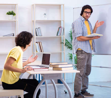 Two male students in the classroomの写真素材