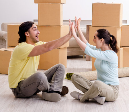 Young pair moving to new apaprtmentの写真素材