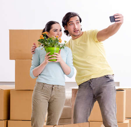 Young pair moving to new apaprtmentの写真素材