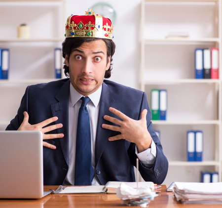 Young king businessman working in the officeの写真素材