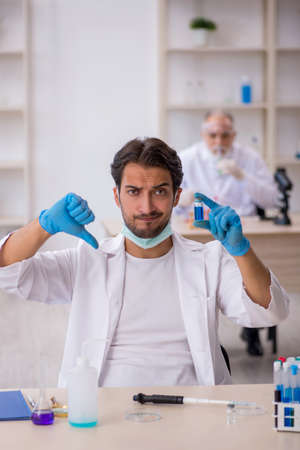 Two male chemist working at the labの写真素材
