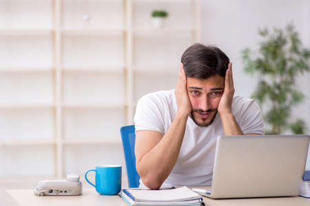 Young man working in the officeの写真素材