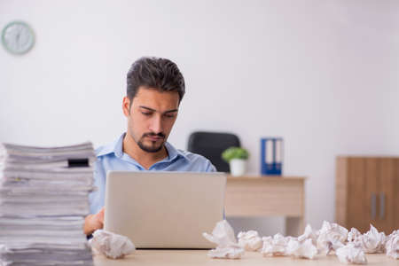 Young male employee rejecting new ideas in the officeの写真素材