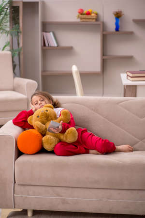 Young little girl staying at home aloneの写真素材