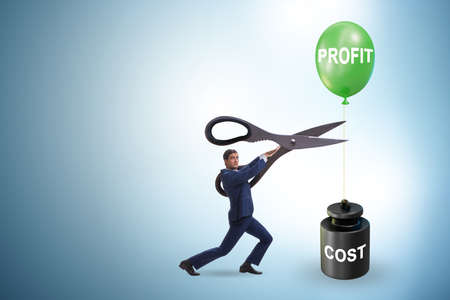 Concept of profit and cost with businessmanの写真素材