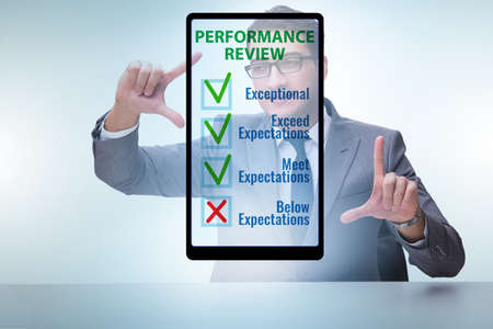 Annual performance review concept with businessmanの写真素材