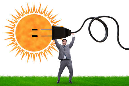 Businessman in solar energy conceptの写真素材