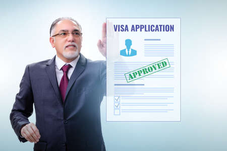 Visa application concept with businessmanの写真素材