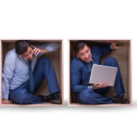 Employee working in tight spaceの写真素材