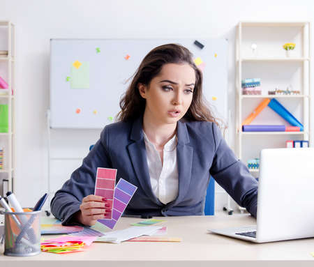 Young female designer working in the officeの写真素材