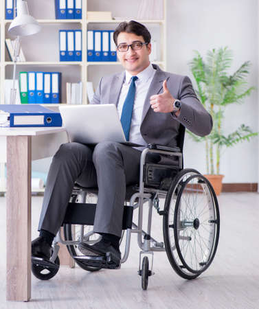 Disabled businessman working in the officeの写真素材