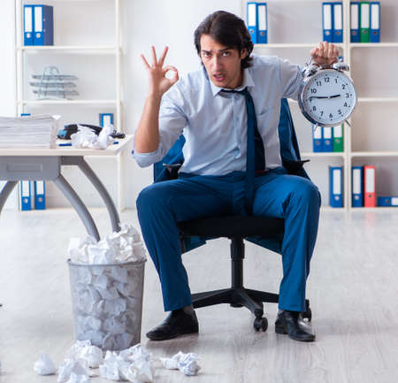 Businessman rejecting new ideas with lots of papersの写真素材