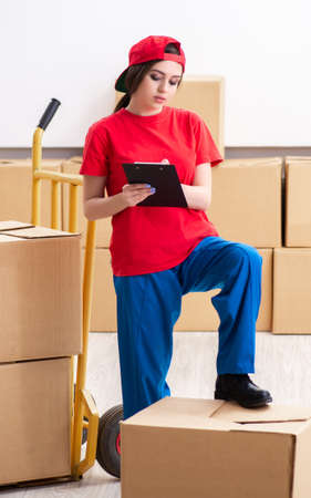 Young female professional mover doing home relocationの写真素材