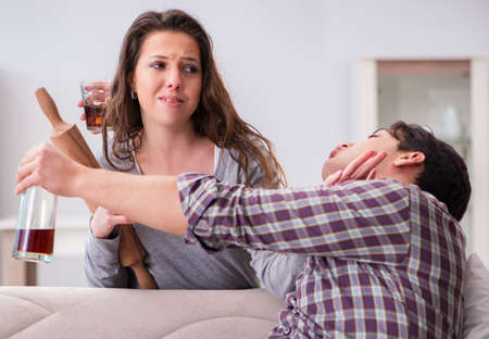 Domestic violence concept in a family argument with drunk alcohoの写真素材