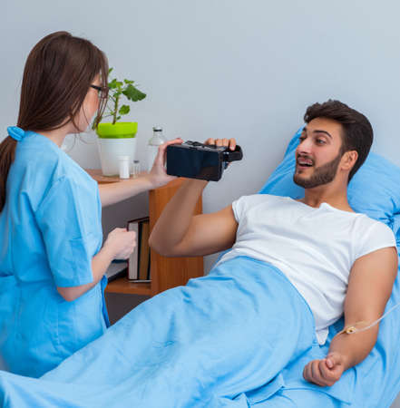 Patient man with VR glasses in telemedicine conceptの写真素材