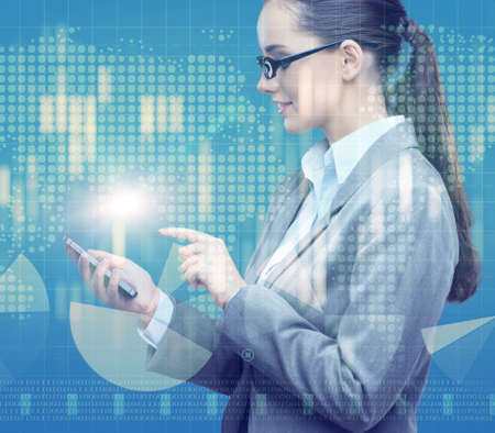 Businesswoman with mobile in business conceptの写真素材