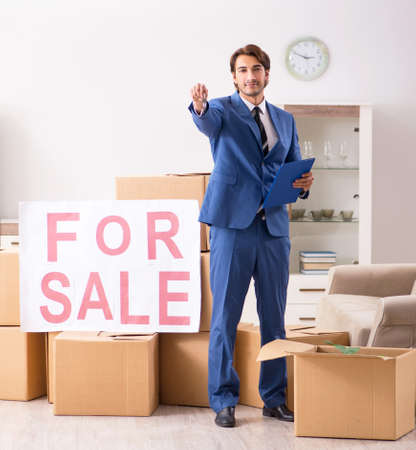The young handsome real estate agent selling a flatの写真素材