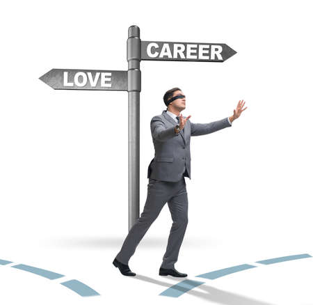 Businessman having hard choice between love and careerの写真素材