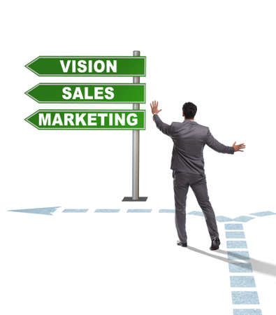 Businessman standing at crossroads of corporate strategyの写真素材