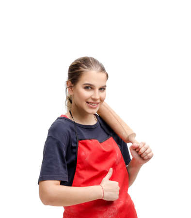 Young female baker isolated on whiteの写真素材