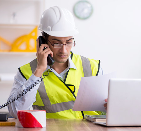 Young male architect working in the officeの写真素材