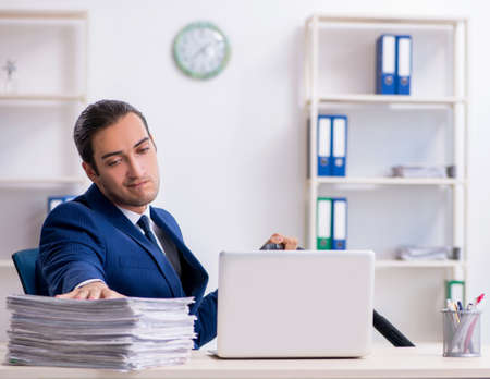 Young father looking after newborn in the officeの写真素材