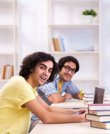 Two male students in the classroomの写真素材