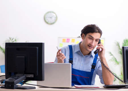 Male it specialist working in the officeの写真素材