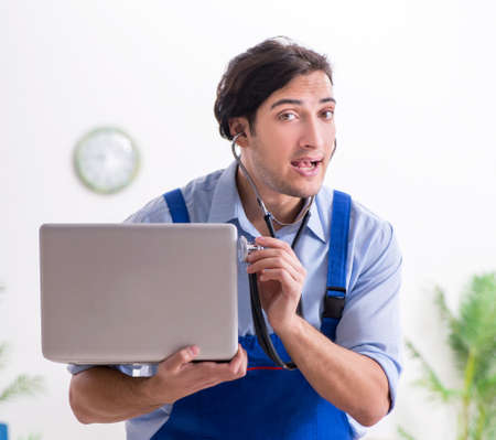 Male it specialist working in the officeの写真素材