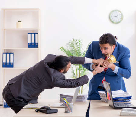 Two male colleagues in the officeの写真素材