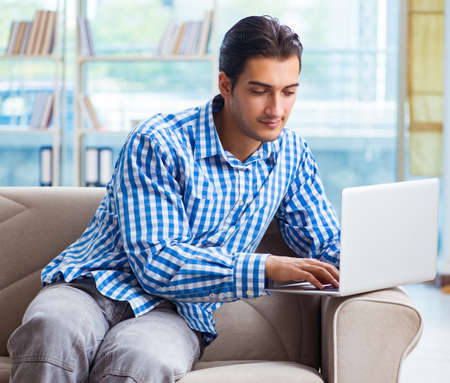 Caucasian student with laptop preparing for university examsの写真素材