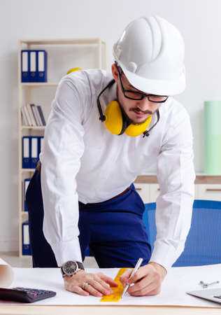 Young male architect working in the officeの写真素材