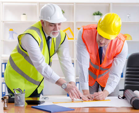 Two engineers colleagues working under projectの写真素材