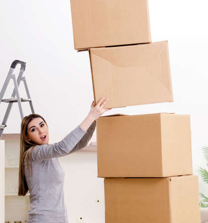 Young beautiful woman moving to new flatの写真素材