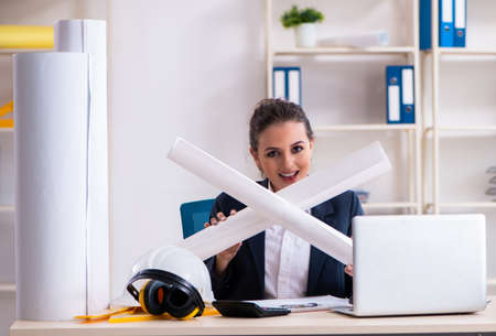 Young female architect working in the officeの写真素材