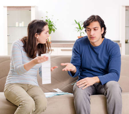 Young couple in budget planning conceptの写真素材