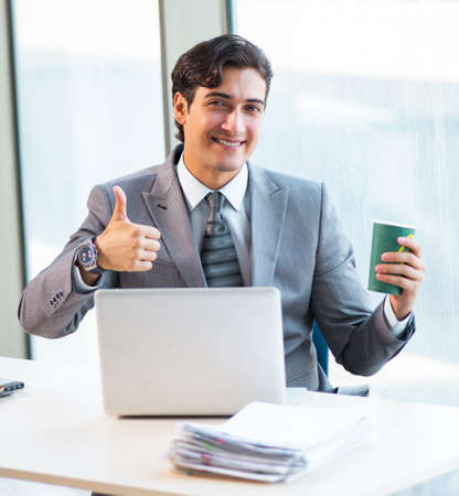 Young successful businessman working at the officeの写真素材