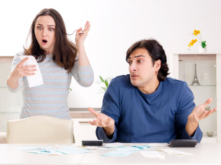 Young couple in budget planning conceptの写真素材