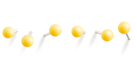 Set of yellow push pins. Thumbtacks ready for your design. Different angle view. Vector illustration isolated on white backgroundのイラスト素材